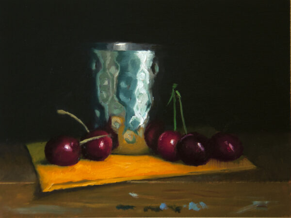 Cherries and stainless steel bowl